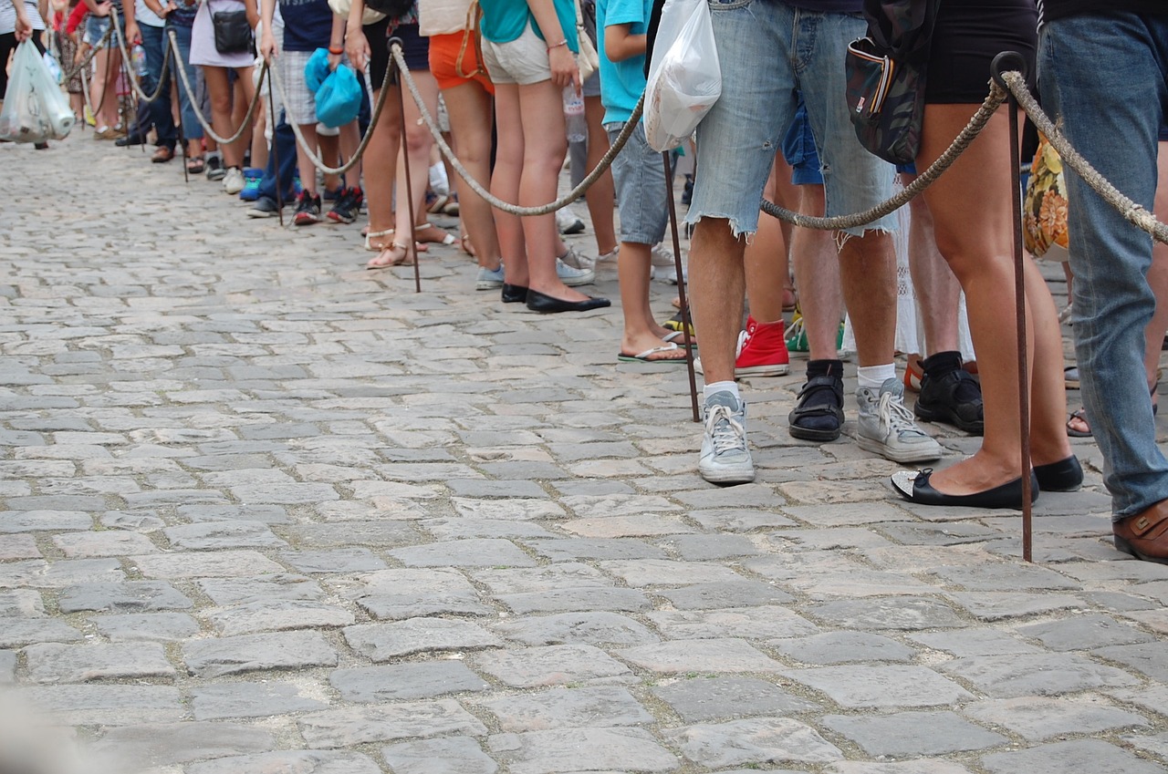 People waiting in a long queue